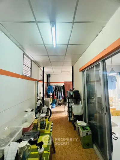 Spacious laundry area with ample storage and natural light