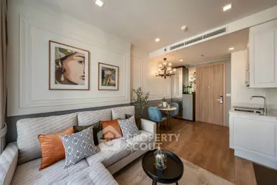 Elegant living room with modern decor, cozy seating, and stylish artwork in a contemporary apartment.