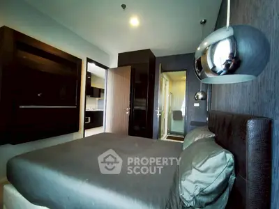 Modern bedroom with sleek design and ensuite bathroom in luxury apartment