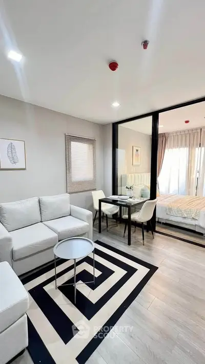 Modern open-plan living room with stylish decor and cozy seating area.