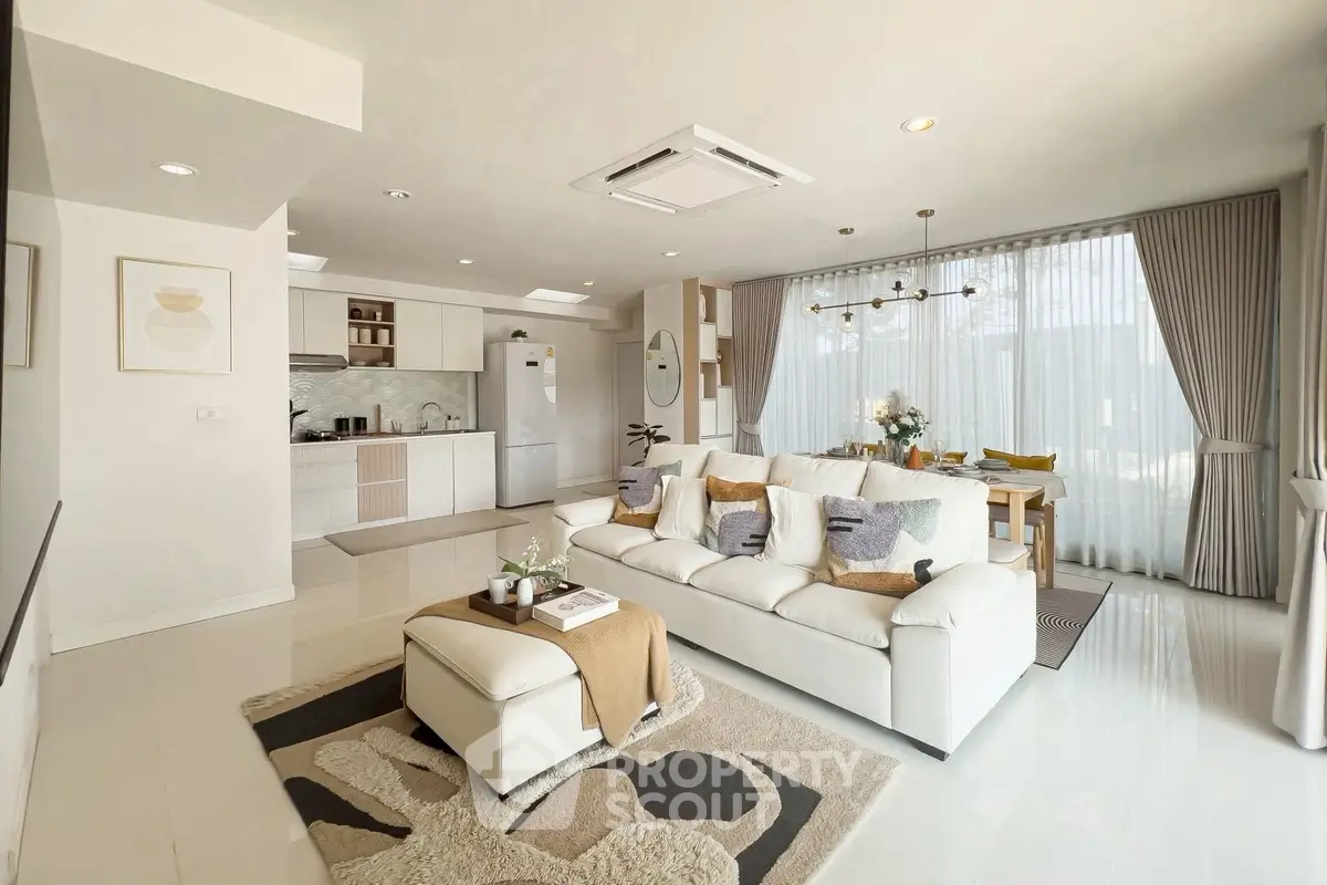 Spacious modern living room with open kitchen and elegant decor