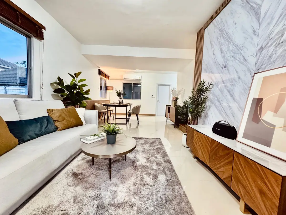 Spacious modern living room with stylish decor and open layout, perfect for relaxation and entertaining.