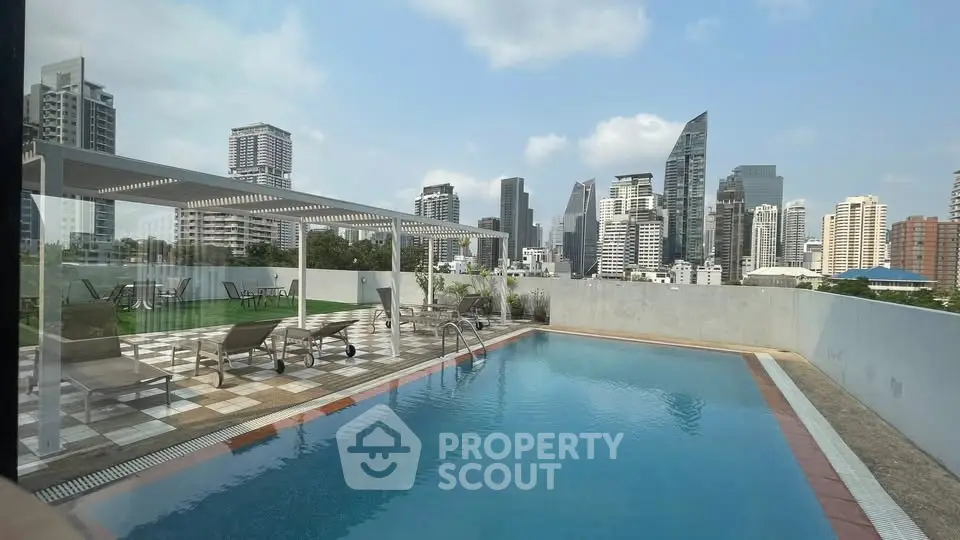 Stunning rooftop pool with city skyline views, perfect for relaxation and entertainment.