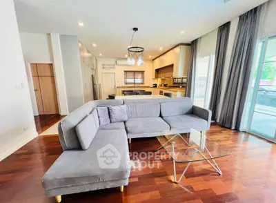 Spacious modern living room with elegant decor and open kitchen layout