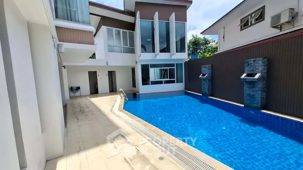 Luxurious modern home with private pool and elegant architecture, perfect for relaxation and entertainment.