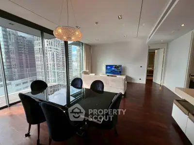 Luxurious modern living room with city view, elegant dining area, and stylish decor in high-rise apartment.