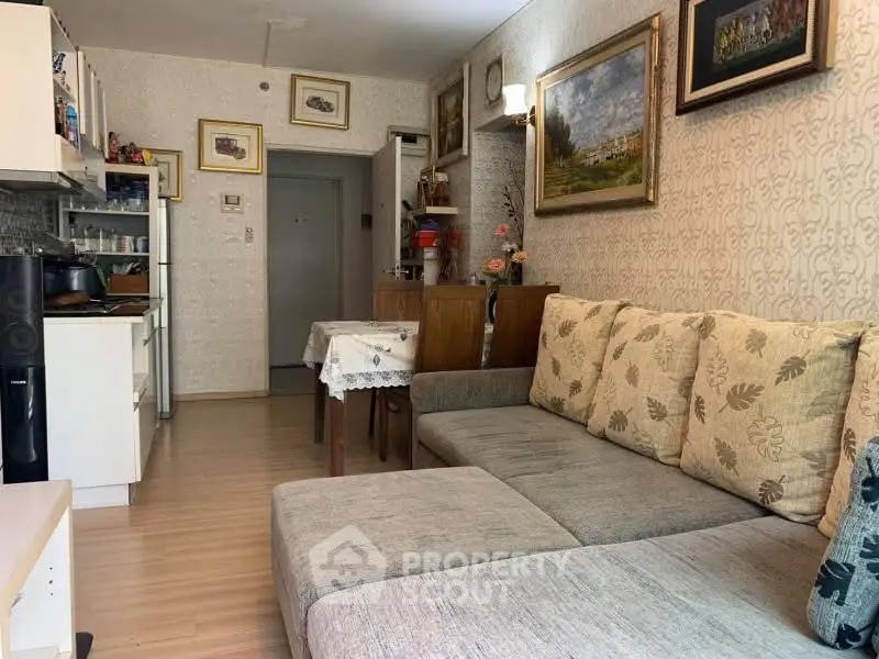 Cozy living room with modern decor and open kitchen layout