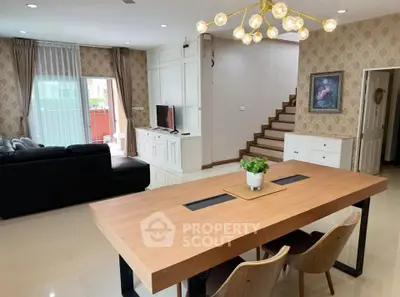 Spacious living room with modern decor and stylish dining area