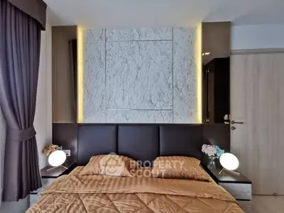 Luxurious bedroom with elegant marble accent wall and ambient lighting
