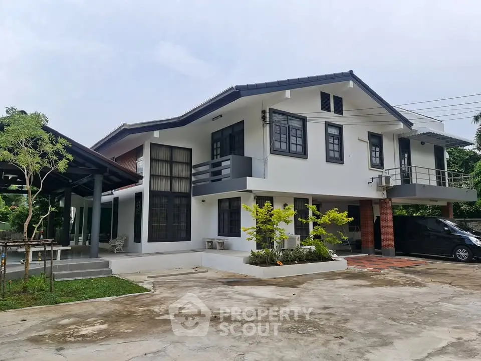 Charming two-story house with modern design and spacious driveway