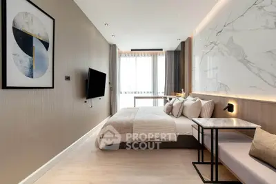 Modern bedroom with stylish decor, large window, and wall-mounted TV in a contemporary apartment.