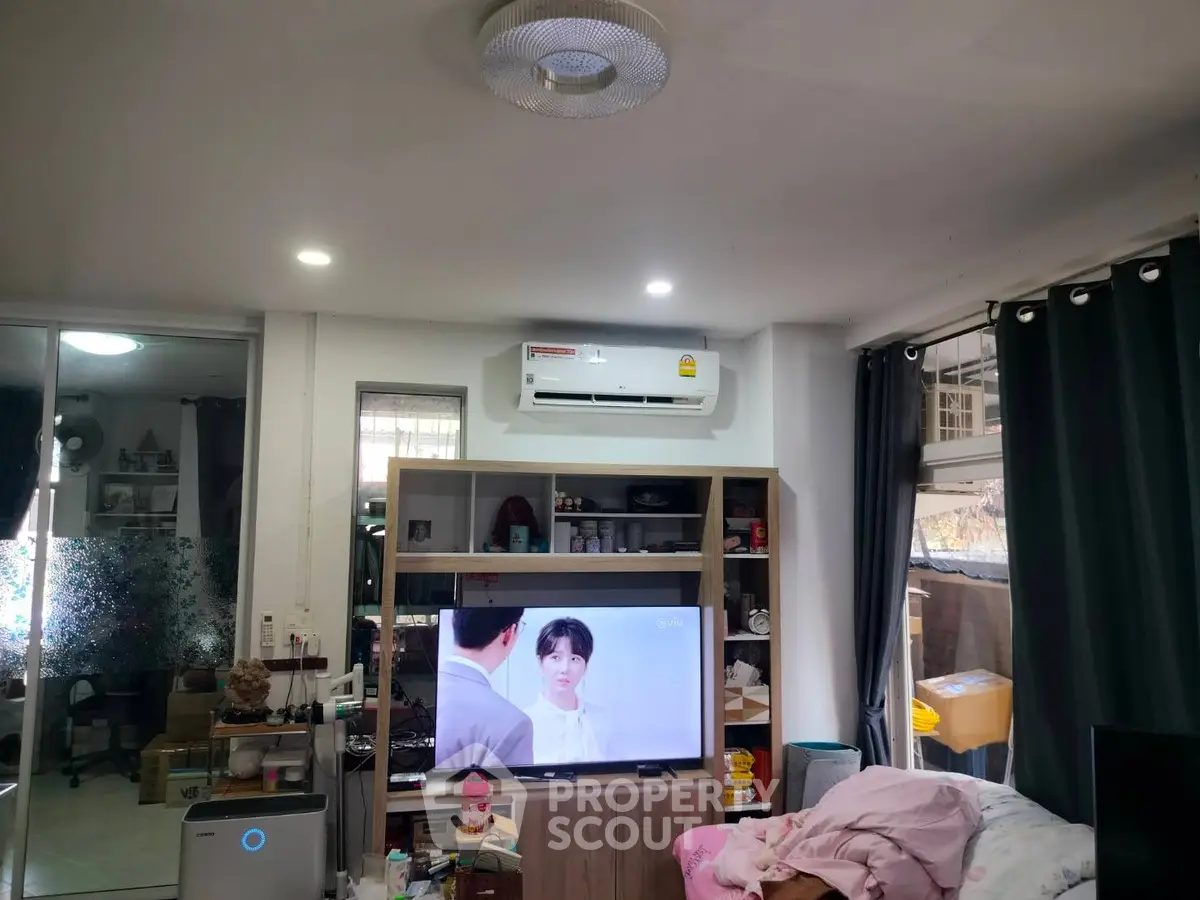 Cozy living room with modern air conditioning and entertainment setup