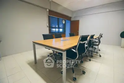 Spacious modern conference room with sleek chairs and large table