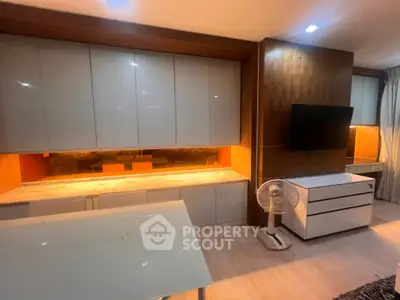 Modern living room with sleek cabinetry and stylish decor