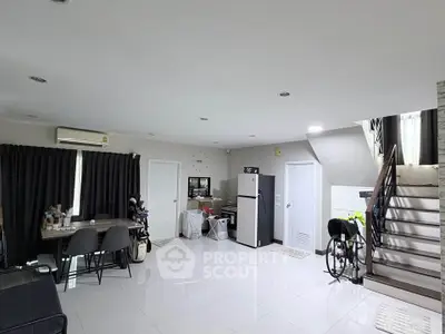 Spacious modern living room with sleek white tiles and stylish furniture