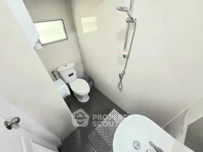Compact modern bathroom with shower and toilet in minimalist design