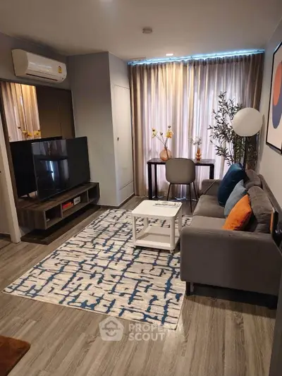 Modern living room with stylish decor, cozy sofa, and elegant lighting in a contemporary apartment.