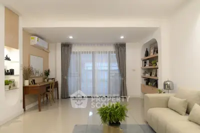 Spacious modern living room with elegant decor and natural light