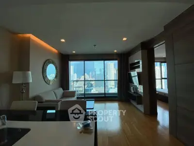 Luxurious living room with stunning city view and modern decor in high-rise apartment.