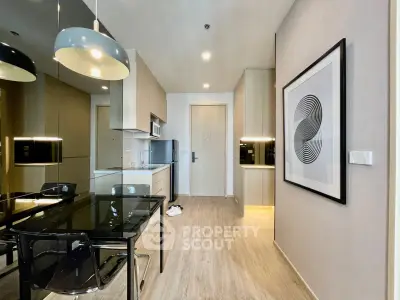 Modern kitchen with sleek design and open layout in contemporary apartment.