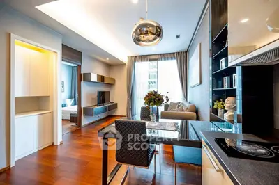 Modern open-layout living room with stylish decor and kitchen area