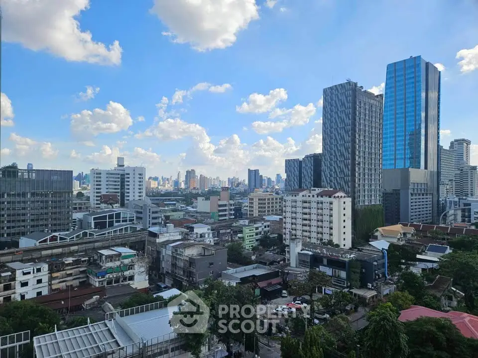 Stunning cityscape view showcasing modern skyscrapers and urban skyline under a vibrant blue sky.