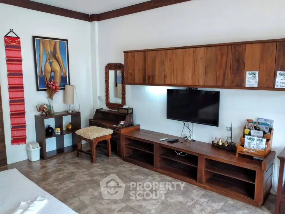 Spacious living room with wooden furniture and modern decor