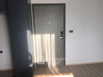 Modern apartment interior with sleek door and minimalistic design