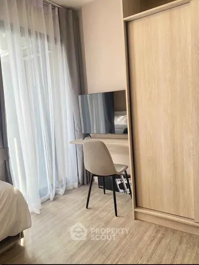 Modern bedroom with sleek furniture and natural light