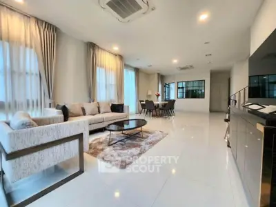 Spacious modern living room with elegant decor and ample natural light