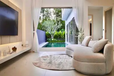 Luxurious living room with pool view, modern sofa, and elegant decor
