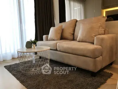 Cozy living room with plush sofa and modern decor