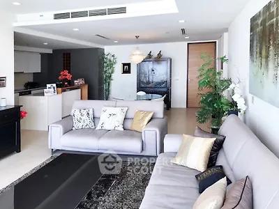 Luxurious modern living room with elegant decor and spacious seating area.