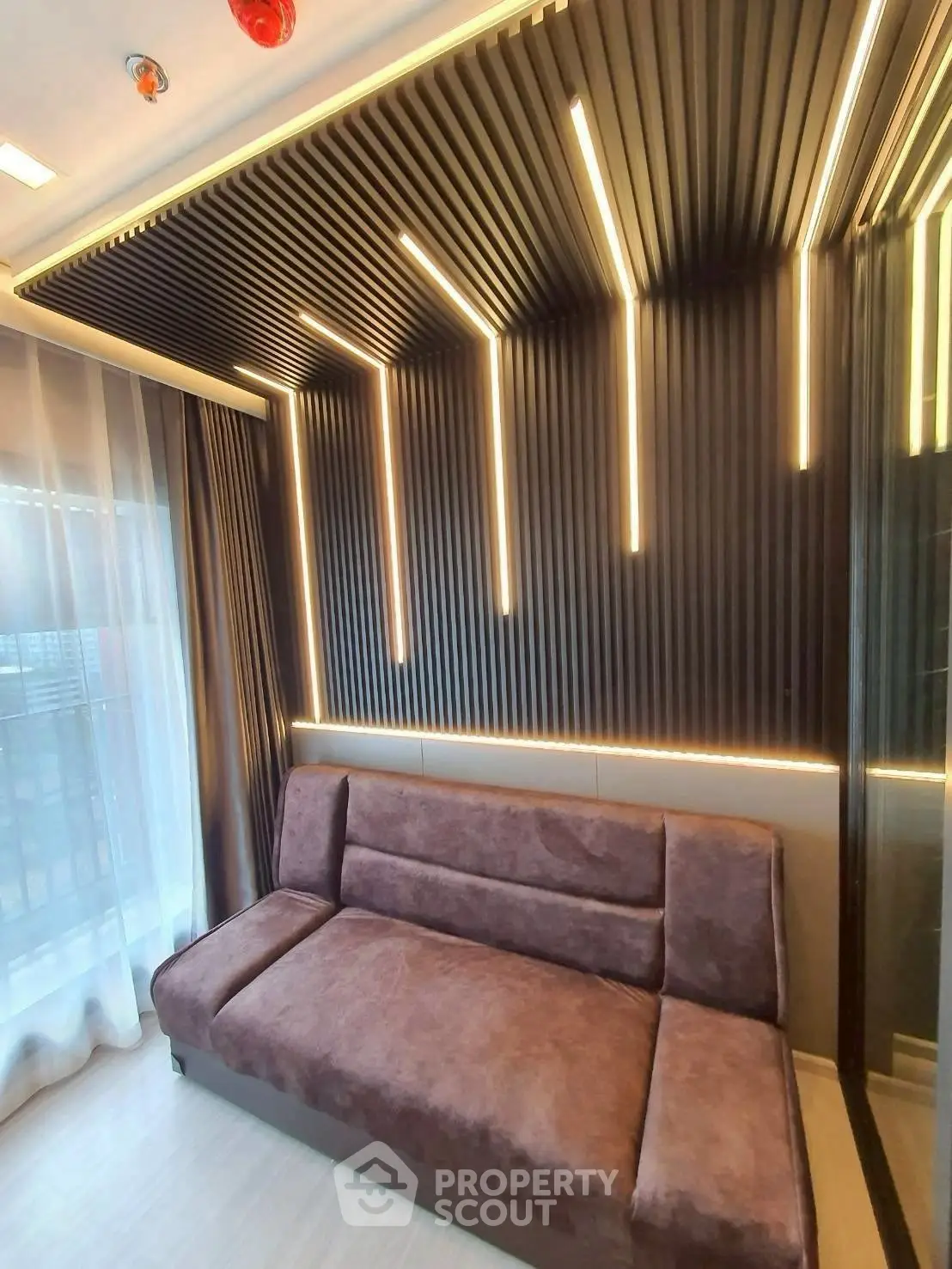 Modern living room with stylish lighting and plush sofa