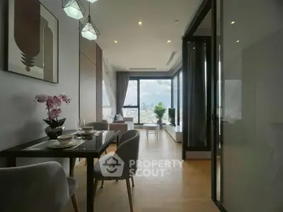 Modern living room with city view, elegant dining area, and stylish decor in a high-rise apartment.