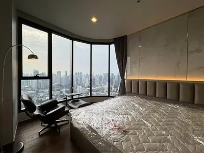Luxurious bedroom with panoramic city view and modern furnishings