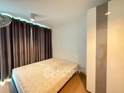Cozy bedroom with modern design, featuring a comfortable mattress and stylish wardrobe, perfect for restful nights.