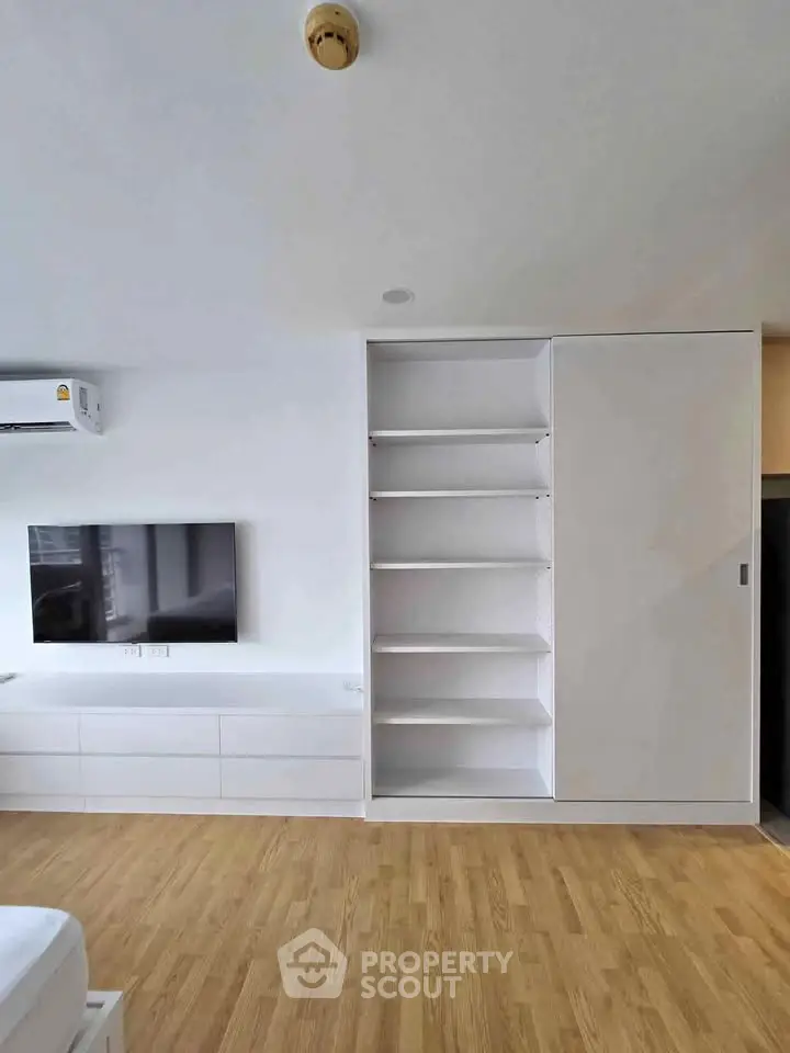 Modern living room with built-in storage and sleek TV setup