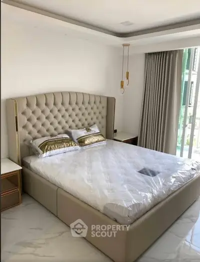 Luxurious bedroom with elegant tufted headboard and modern decor