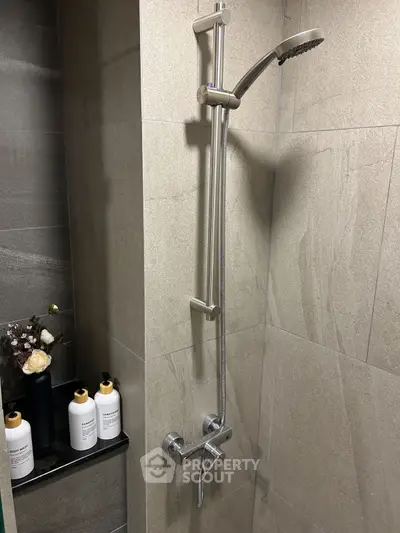 Modern bathroom shower with sleek fixtures and elegant tile design