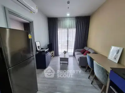 Modern living room with sleek furniture and natural light, perfect for cozy urban living.