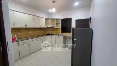 Spacious kitchen with ample cabinetry and modern appliances in a contemporary home.