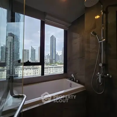 Luxurious bathroom with city view and modern fixtures in high-rise apartment.