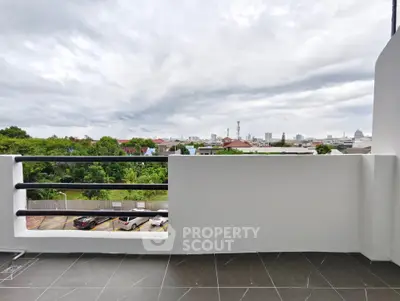 Spacious balcony with city view and modern railing design