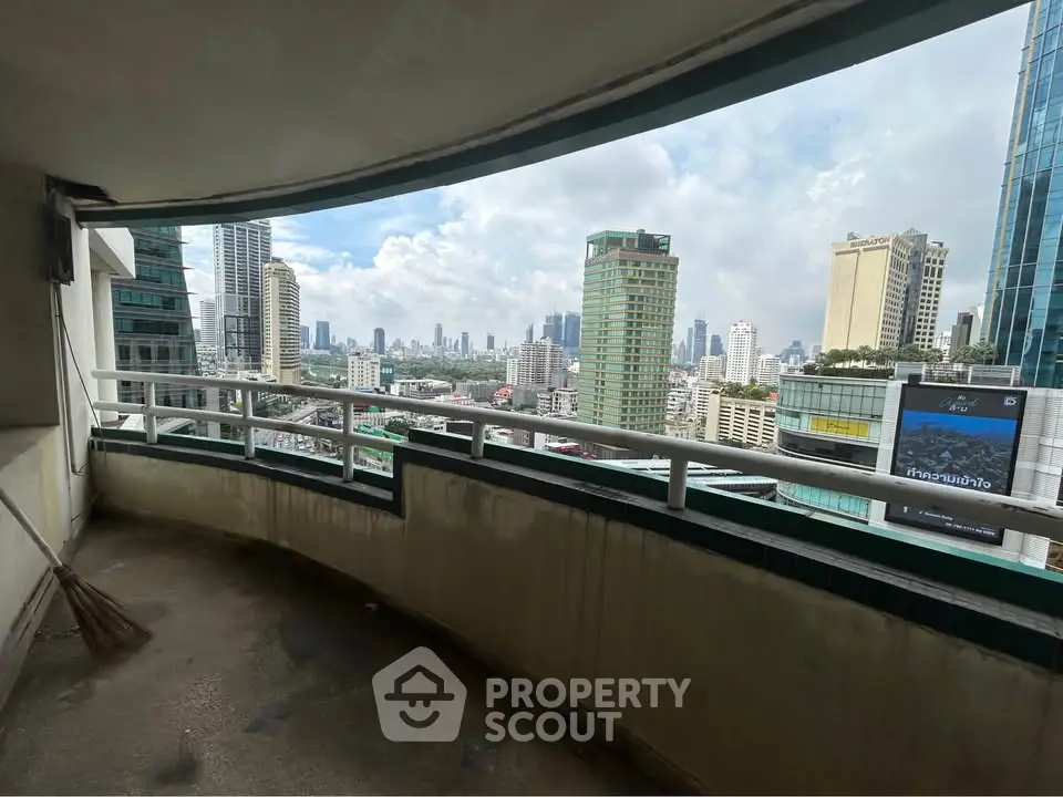 Spacious balcony with stunning city skyline view, perfect for urban living enthusiasts.