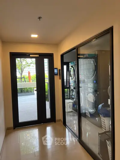 Modern apartment building with laundry facilities and outdoor view