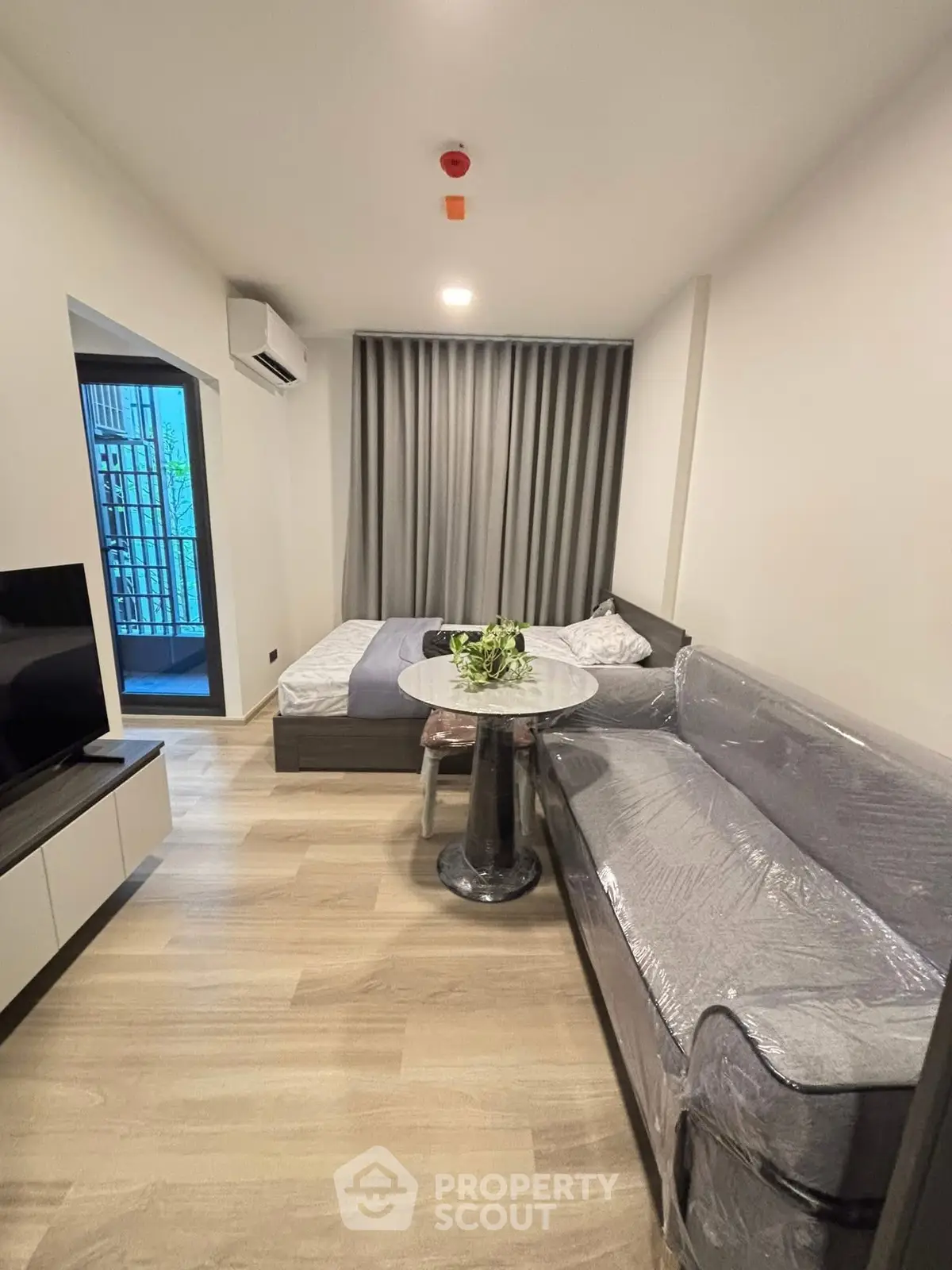 Modern studio apartment with cozy living area and stylish decor