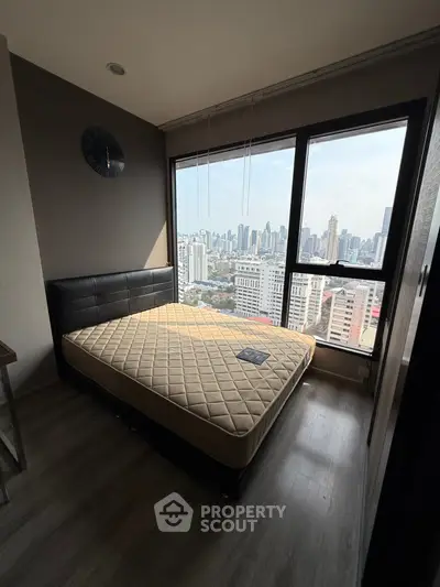 Modern bedroom with city view and stylish decor