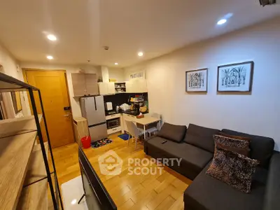 Cozy modern living room with open kitchen and stylish decor