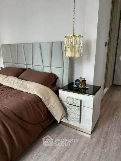 Luxurious bedroom with elegant decor and modern lighting